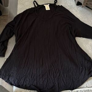 Size L, black blouse, spaghetti straps and open holes on shoulders. Maddie M